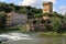 Waterfall on Arno River and ancient tower in Florence, Italy