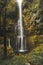 Waterfall around the levada faja do rodrigues trail on the island of Madeira, Portugal. A waterfall in the middle of an