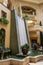 The waterfall atrium surrounded by lush green trees and plants at The Venetian Resort and Hotel in Las Vegas Nevada