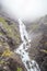 Waterfall and bridge on the Norwegian Scenic Route Geiranger - Trollstigen in Sunnmore region, More og Romsdal, Norway