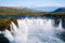 Waterfall cascade Godafoss with rainbow, Iceland