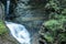 Waterfall cascading into Glen creek along the Gorge trail in Watkins Glen State Park New york. Warm autumn day. Daylight