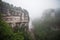 waterfall cascading over canyon walls, with mist in the air