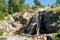 Waterfall cascading over rocks in Sapokka landscaping park Kotka, Finland