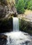 Waterfall cascading into a pool