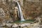 Waterfall Cascata Ampola with green lake