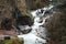 Waterfall in cliffy mountains of Abkhazia