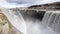 The waterfall closes the slow motion, A huge mass of water falls down from the cliff. Millions of splashes fly apart. Slow motion