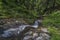 Waterfall on Divoky creek near Kouty nad Desnou village in summer day