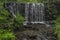 Waterfall on Divoky creek near Kouty nad Desnou village in summer day