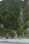 Waterfall and Eternal Spring Shrine at steep mountain at Taroko, Taiwan