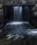 Waterfall falling between rocks