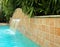 Waterfall feature in a beautiful swimming pool