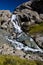 Waterfall flowing from Ala-Kul lake. Kyrgyzstan