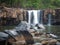 waterfall flowing in the deep forest, shady atmosphere.