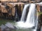 waterfall flowing in the deep forest, shady atmosphere.