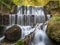 Waterfall in the forests of the Carpathian Mountains in Sinaia, Romania