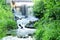 Waterfall in green leafs