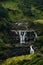 Waterfall among the green mountains. Waterfalls Of Sri Lanka. Landscapes Of Asia. Aerial photography. Tea plantation. Green hill.