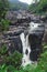 Waterfall among green vegetations