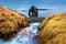 Waterfall and Hvitserkur is spectacular rock in the sea on the Northern coast of Iceland