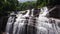 Waterfall in the jungle. Olu Ella Falls in the rainforest. Sri Lanka.