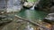 Waterfall and lake with clear water in wild nature