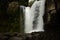 Waterfall landscape. Amazing Tegenungan waterfall in tropical rainforest in Bali near Ubud. Strong dynamic water flow. Bali,