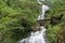 Waterfall landscape with arch bridge