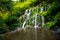 Waterfall landscape. Beautiful hidden Banyu Wana Amertha waterfall in Bali. Waterfall in tropical rainforest in Wanagiri. Slow