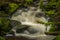 Waterfall on Lesni creek in Sumava national park in spring day