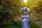 Waterfall among many foliage, In the fall leaves Leaf color change In Yamagata, Japan.Onsen atmosphere