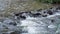 Waterfall mountain close water rocks in summer