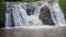 Waterfall mountain close water rocks in summer