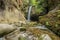 Waterfall in the mountains in a remote location with long exposure.