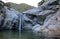 Waterfall and natural swimming pool at Cascada Sol Del Mayo on the Baja California peninsula in Mexico