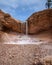 Waterfall oasis in a rocky desert landscape. Bryce Canyon National Park.