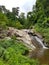 Waterfall pai thailand north chiang mai stones rocks cliffs water flowing down tree green rain forest swimming light sky