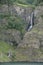 A waterfall pouring into the fjord