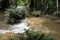 waterfall in rainforest. cascade in forest. water flowing in tropical jungle