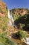 Waterfall reflecting a rainbow