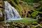 Waterfall and river in canyon