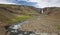 Waterfall and river in Hengifoss valley, Iceland East fjords.