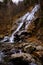 Waterfall and rocks and ice