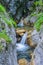 waterfall between rocks in the mountain