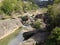 Waterfall between rocks and scenic greenery