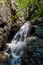 Waterfall with rocks and trees around on Horne diery gorge in Mala Fatra mountains in Slovakia