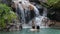 Waterfall with romantic couple bathing having fun