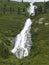 Waterfall at Schlegeisspeicher reservoir at Berlin high path, Zillertal Alps in Tyrol, Austria