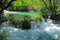 Waterfall with small cascades of water in the Plitvice lakes national Park in Croatia